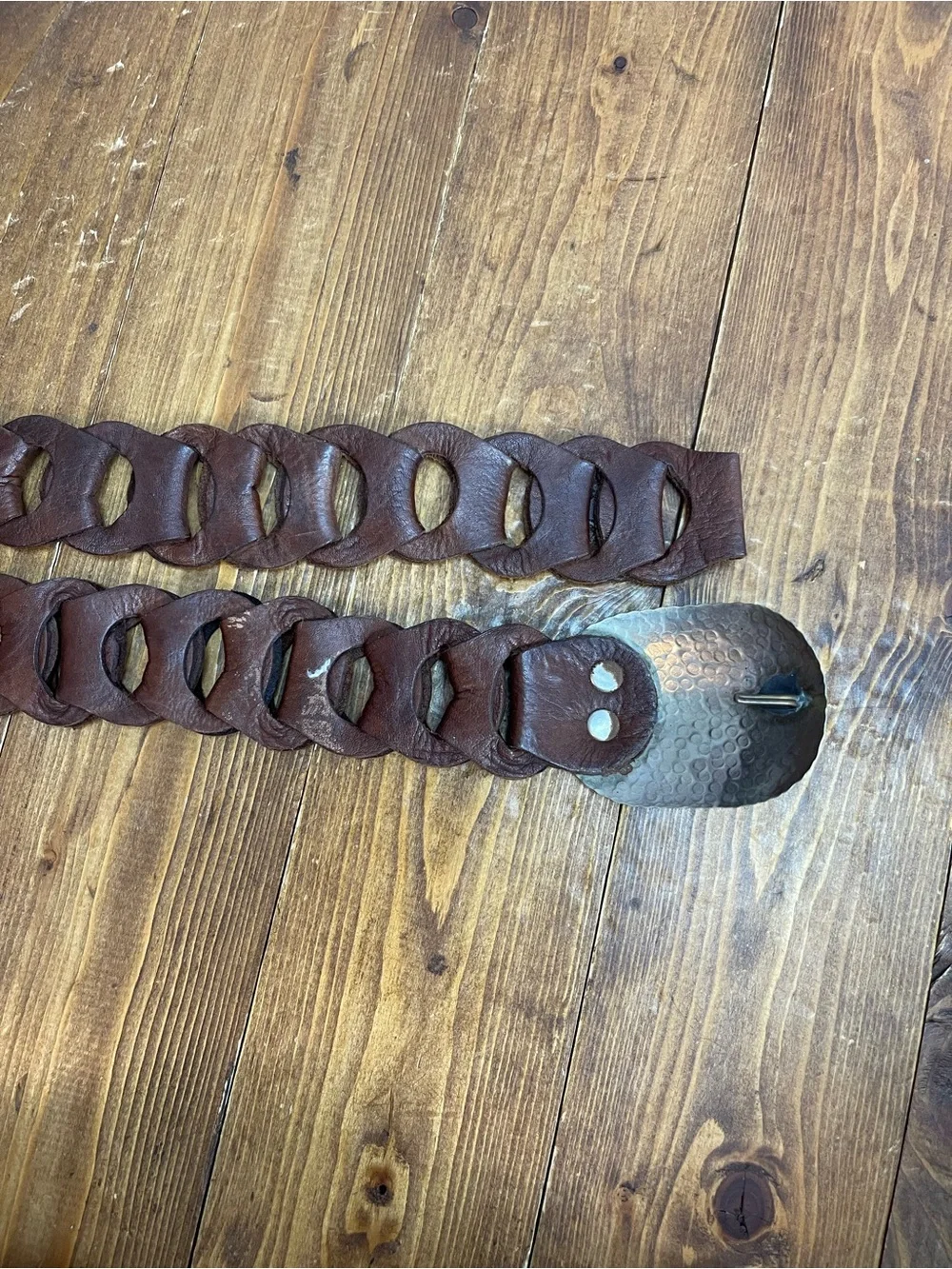 Linked leather belt with silvertone hammered buckle